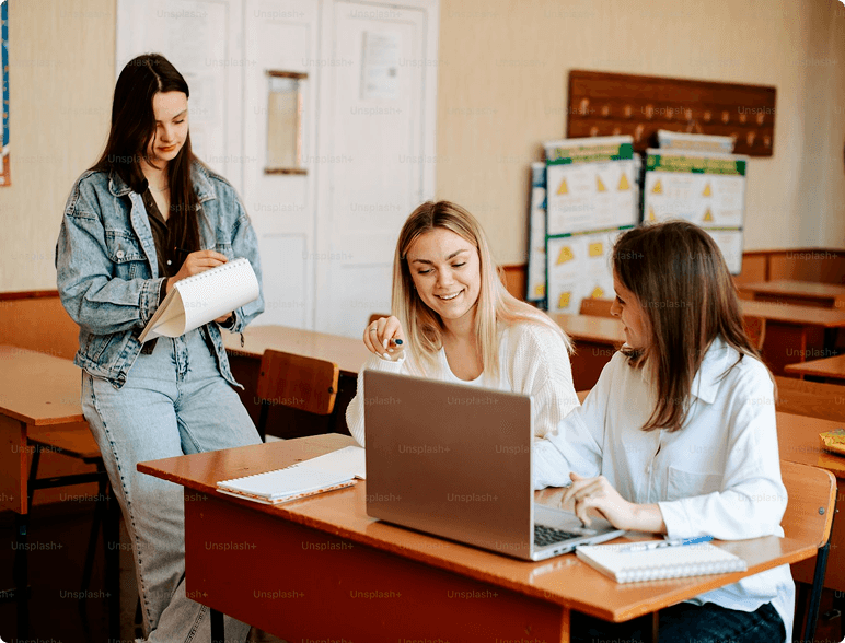Person using phone and laptop